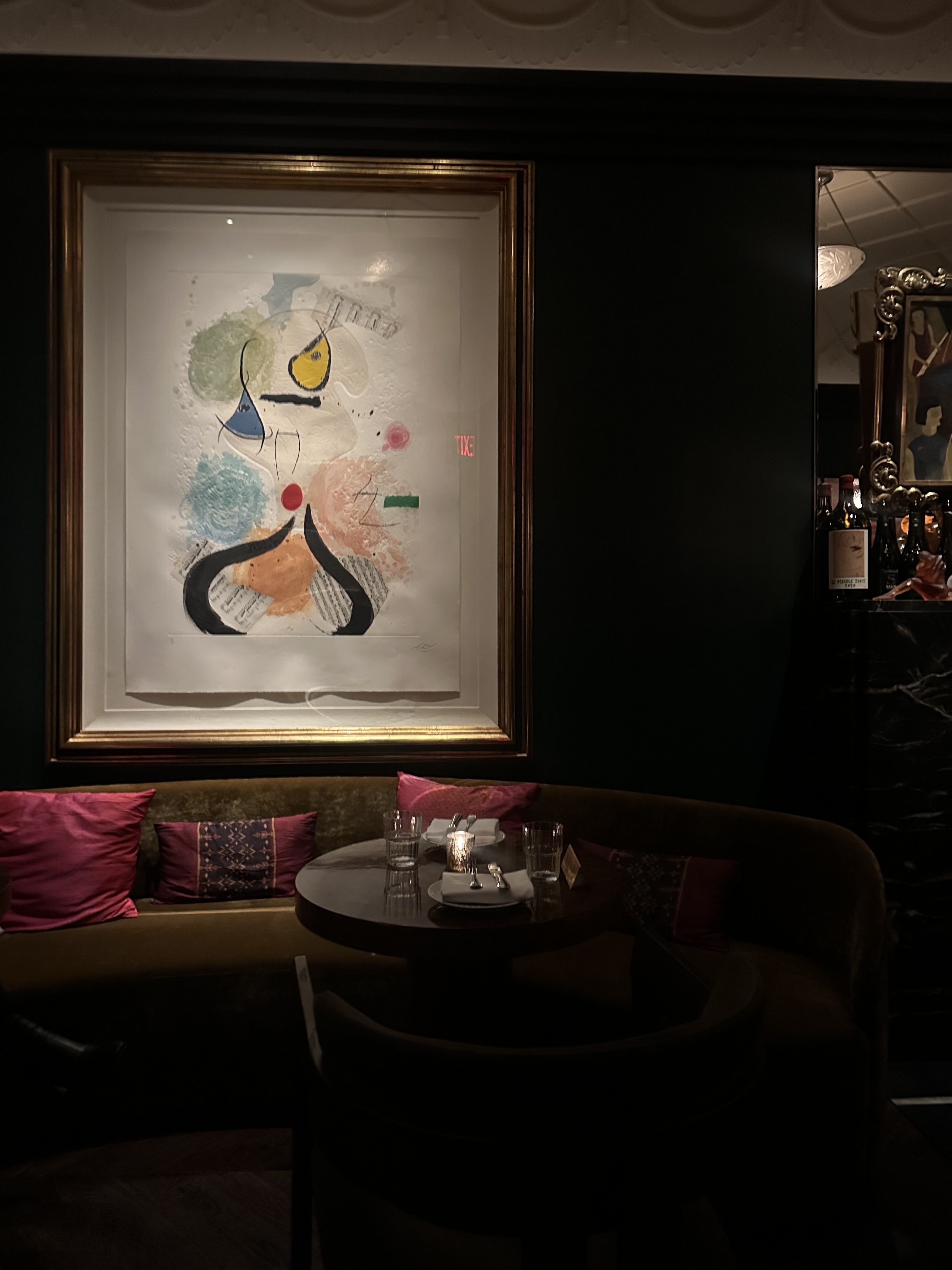 a photo of a dimly lit bar