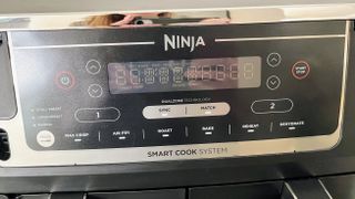 Ninja DZ550 Foodi 6-in-1 10-qt. XL 2-Basket Air Fryer being tested in writer's kitchen