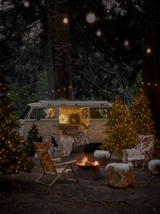 camper van with outdoor Christmas lights