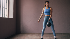 A woman doing kettlebell swings