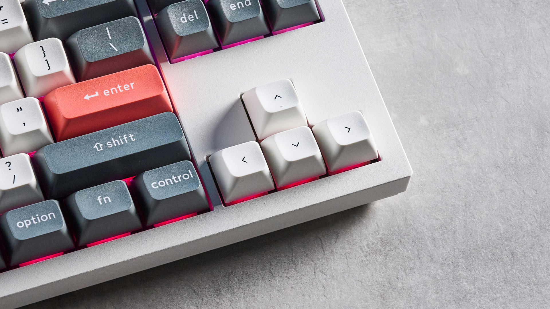 Keychron Q3 Ultra 8K photographed on a grey table in front of a blue background