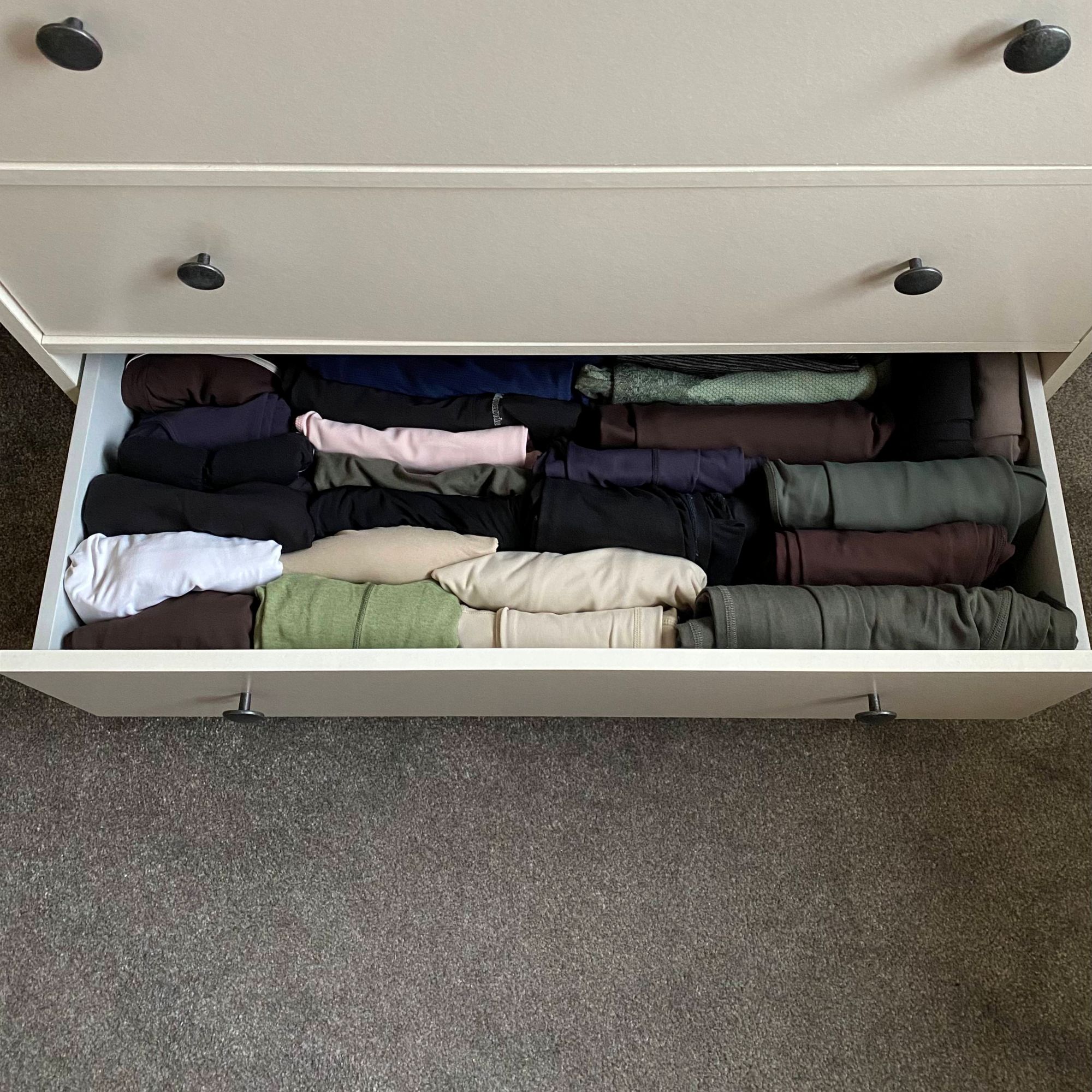 Katie trying the KonMari folding method to organise her clothes