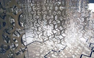 Artwork with aluminium plates and chains