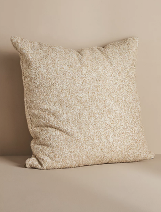 Tan boucle throw pillow from Anthropologie.