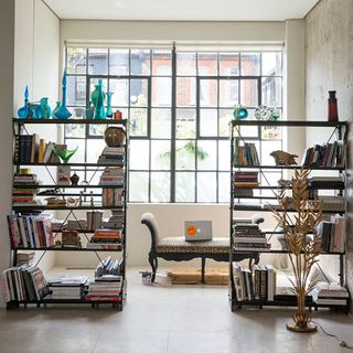 living room with white wall and book shelves