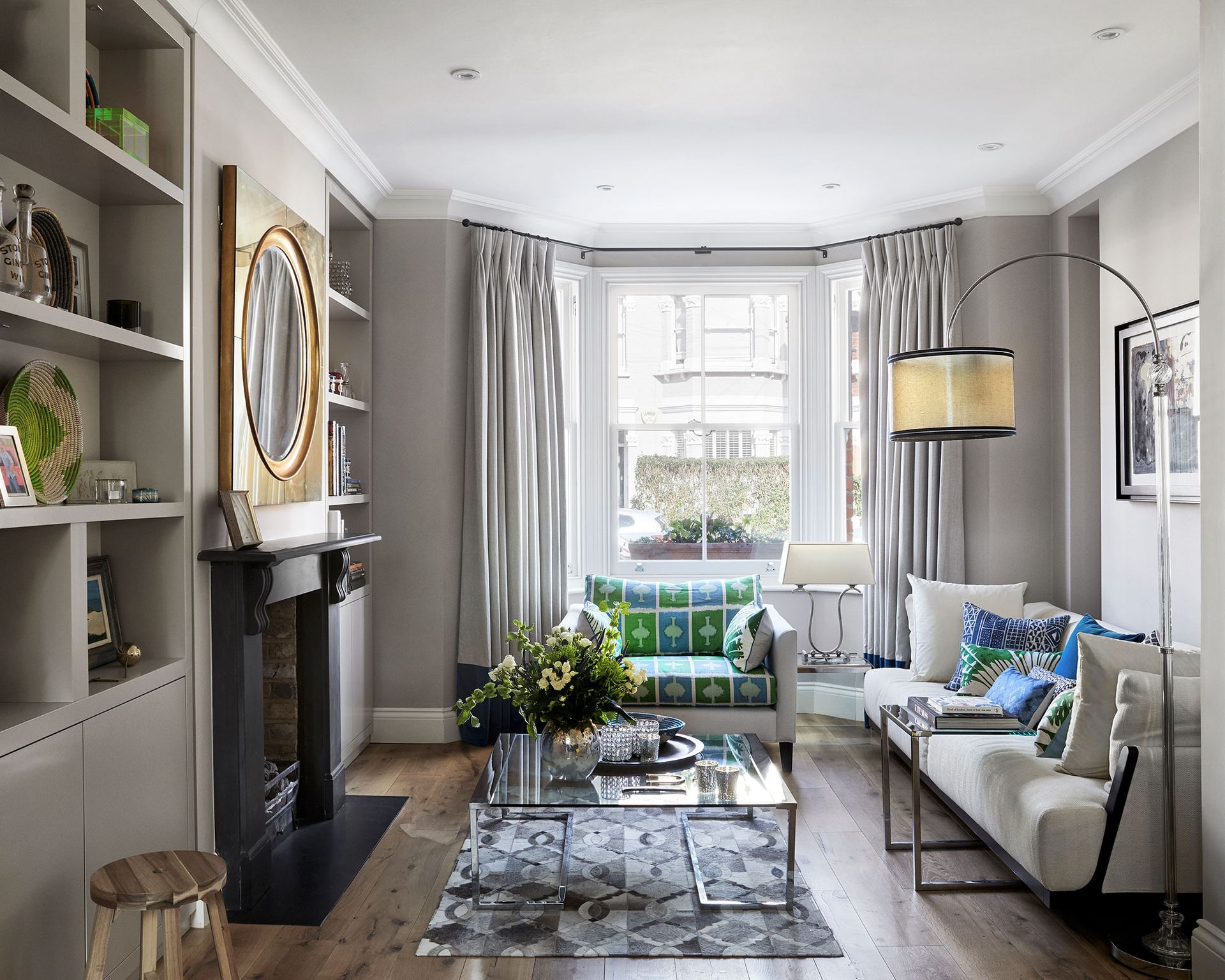 A small living room with grey walls