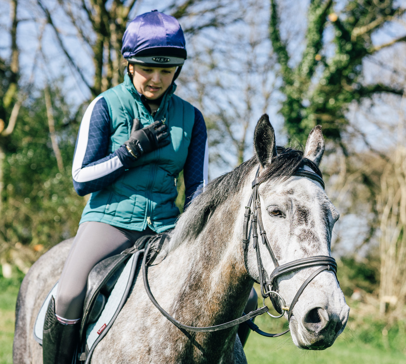 Woman on horse regulating breathing