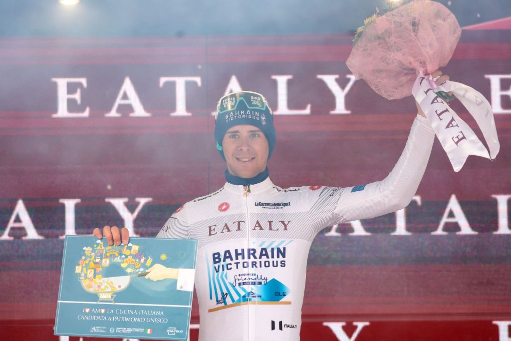 Team Bahrain's Italian rider Antonio Tiberi celebrates his white jersey of best young on the podium after the 16th stage of the 107th Giro d'Italia cycling race, 206km between Livigno and Santa Cristina Val Gardena on May 21, 2024. Team UAE's Slovenian rider Tadej Pogacar wins his 5th stage in the 107th Giro d'Italia cycling race. (Photo by Luca Bettini / AFP)