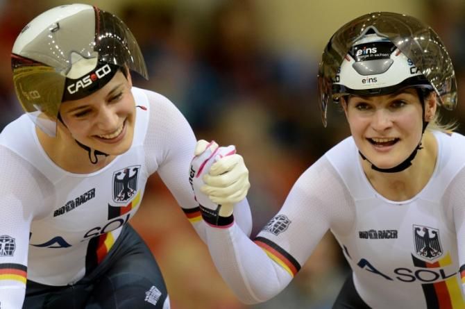 Germany's Miriam Welte (L) and Kristina Vogel celebrate their gold medal in the women's team sprint during the UCI Track World Championships in Minsk.