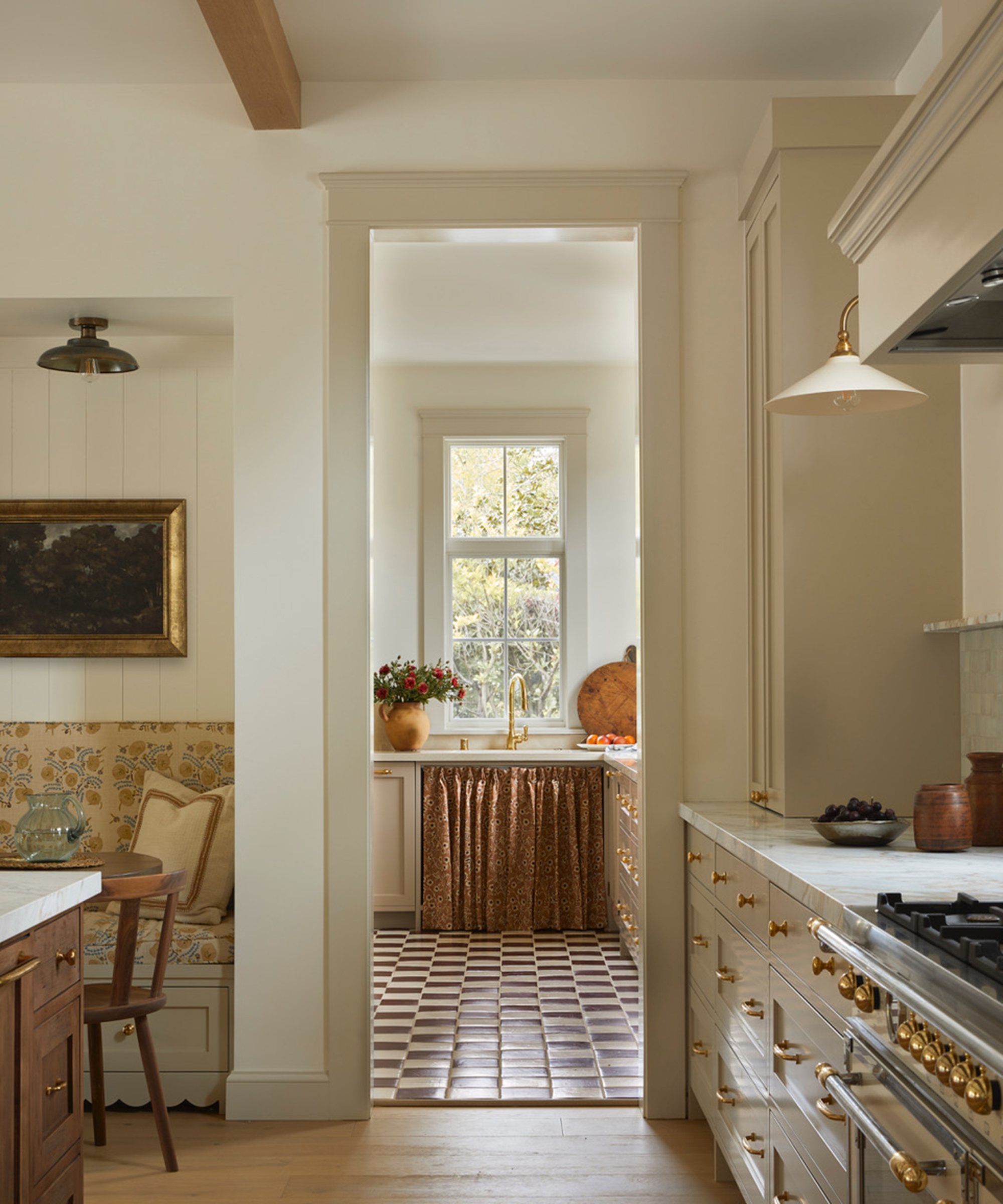 white kitchen with wood flooring