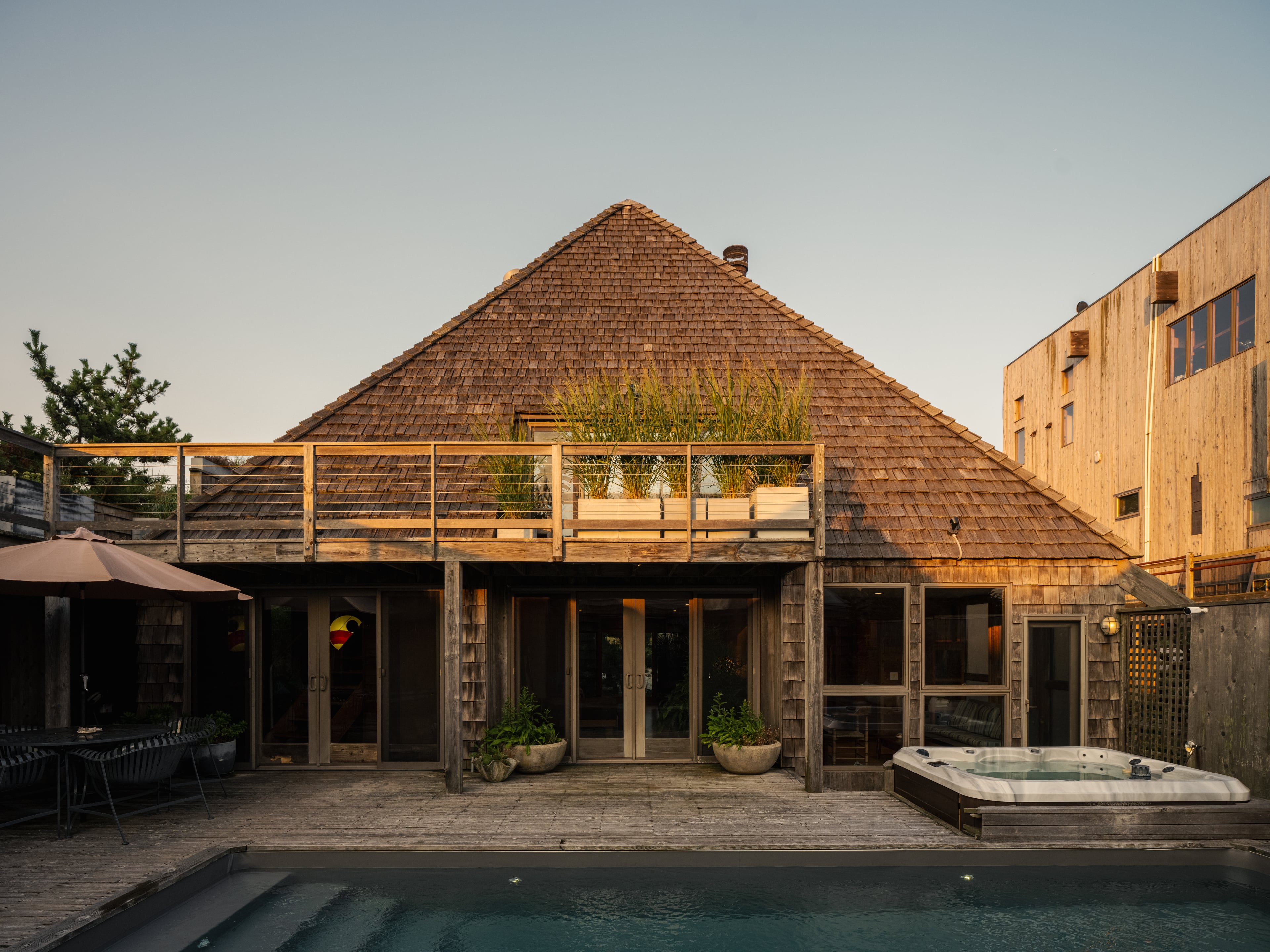 The primary suite is located on the lower level, adjacent to the pool