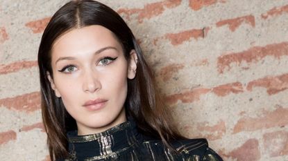 Model Bella Hadid is seen wearing eyeliner backstage ahead of the Alberta Ferretti show during Milan Fashion Week Fall/Winter 2018/19 on February 21, 2018 in Milan, Italy. 