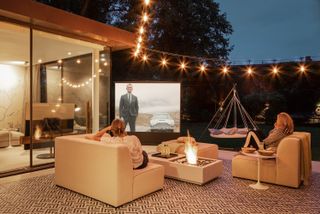 outdoor cinema with sofas and festoon lights