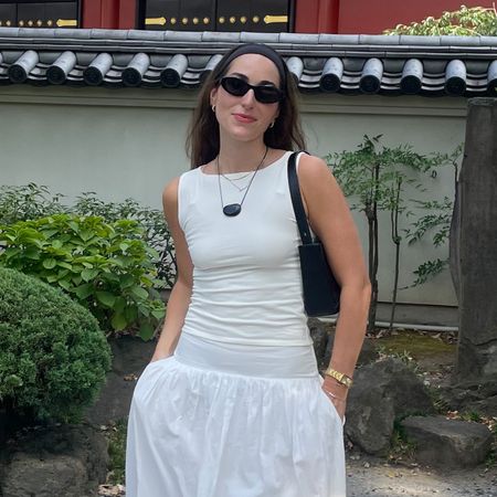 Who What Wear editor Anna LaPlaca wears white Reformation dusk top and white skirt.