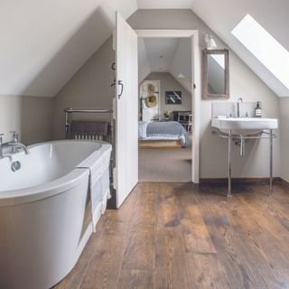 engineered wood bathroom flooring in ensuite with cream walls