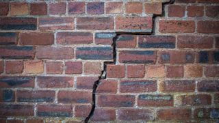 brick wall with a crack running through it
