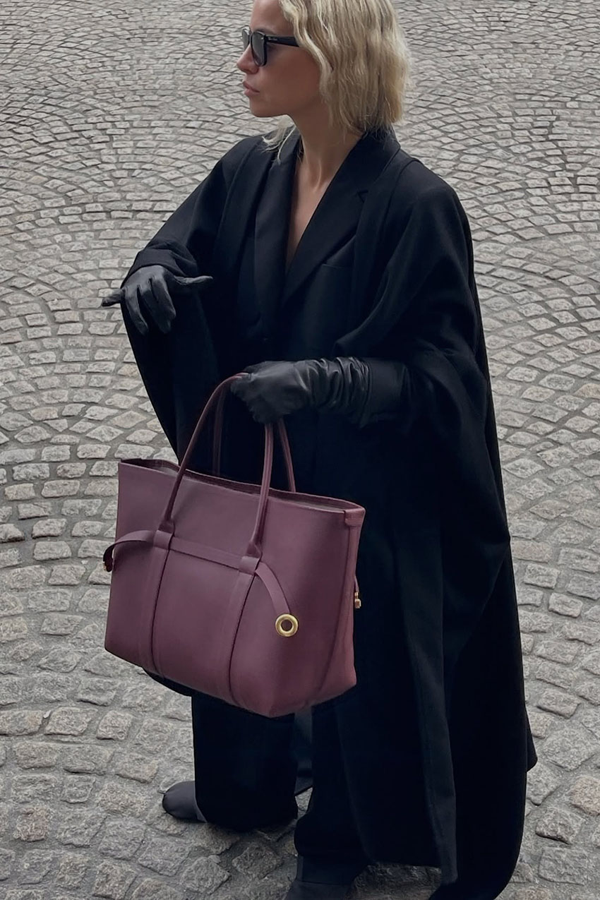 woman wearing leather gloves