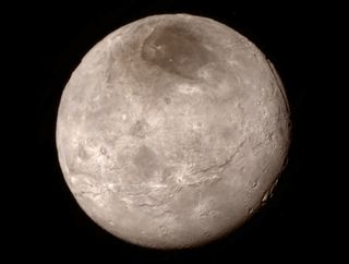 Canyons up to 6 miles (10 kilometers) deep are visible in this photo of Pluto’s largest moon, Charon, captured by NASA’s New Horizons probe on July 14, 2015 from a distance of 289,000 miles (466,000 kilometers).