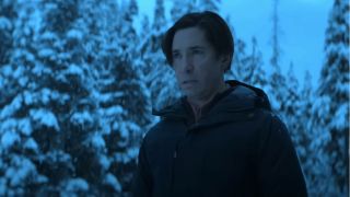 Justin Long stands very creepy like in the middle of a snowstorm in Goosebumps.
