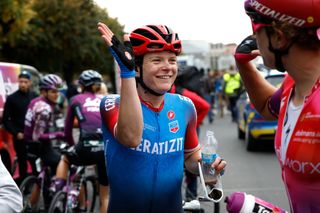 Marta Lach high-fives after winning a stage in Tour de Romandie