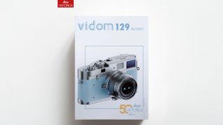 Cover of "vidom 129" featuring a stylish Leica camera illustration, celebrating 50 years of Leica Historica