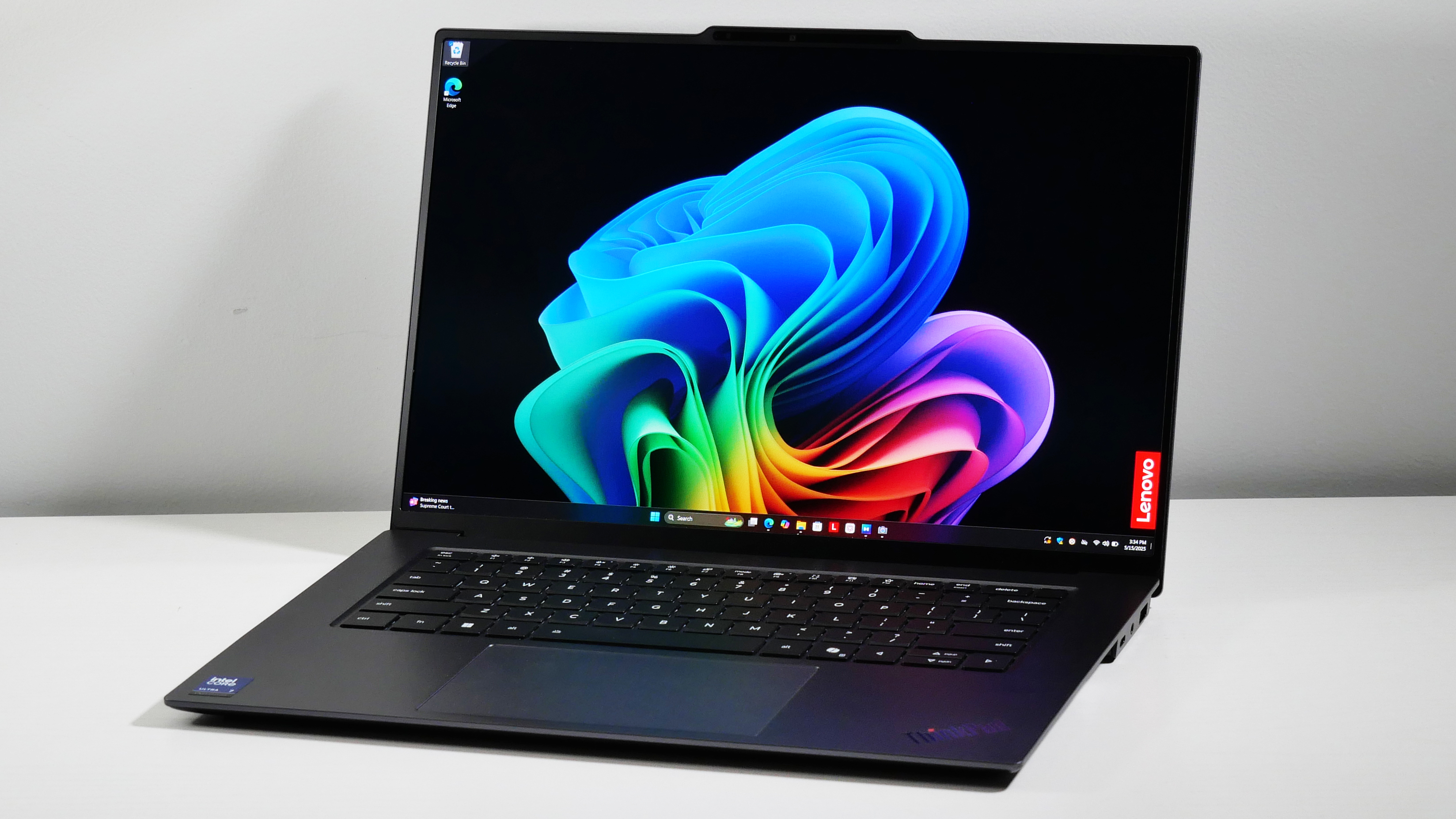 Lenovo ThinkPad X9-15 Gen 1 Aura Edition open at an angle on a white desk.