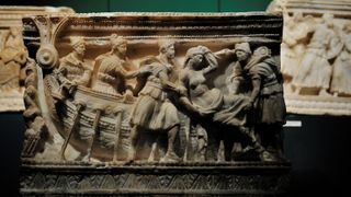 An Etruscan funerary urn showing the abduction of Helen by Paris, the mythical event said to have caused the advent of the Trojan War.