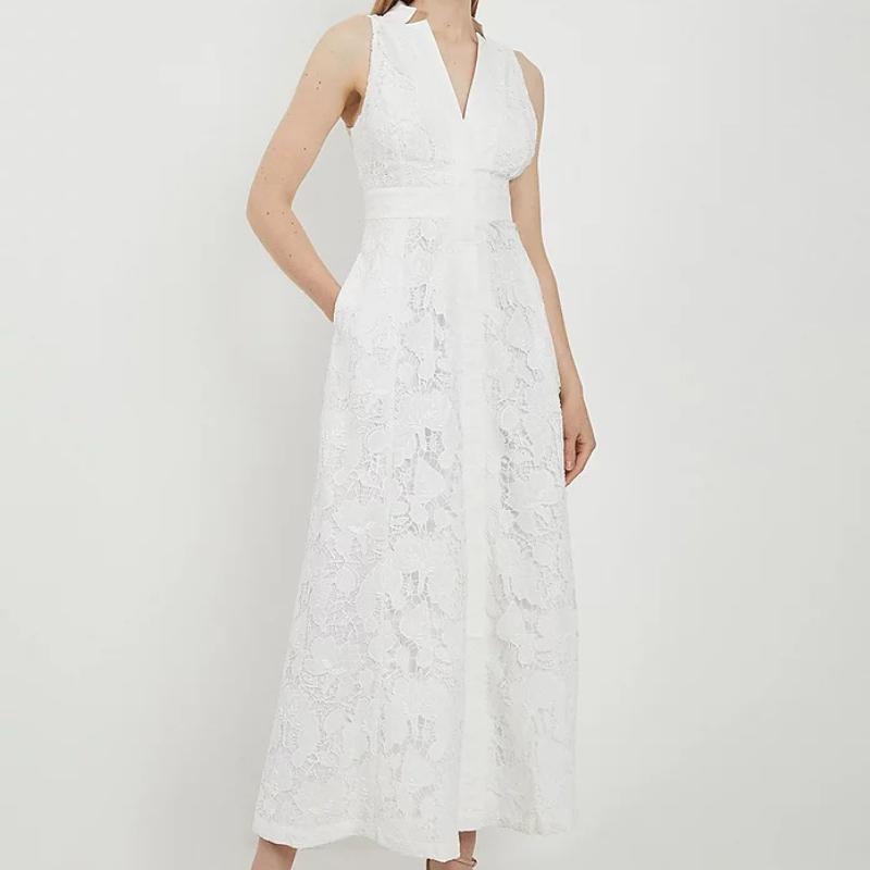 A pic of a model in a white lace dress