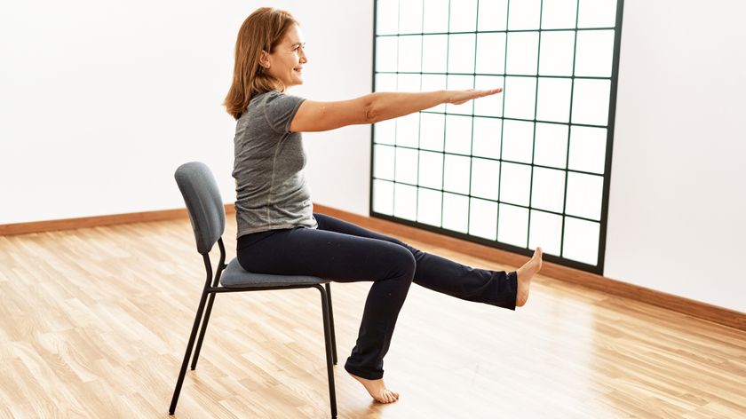 a senior woman doing a chair workout
