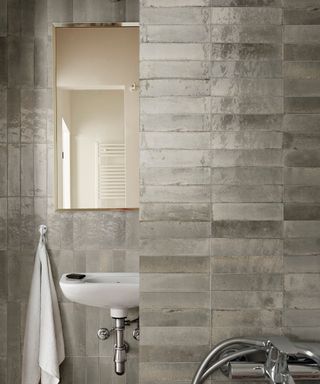 Shiny gray bathroom tiles by Stone and Ceramic Warehouse.