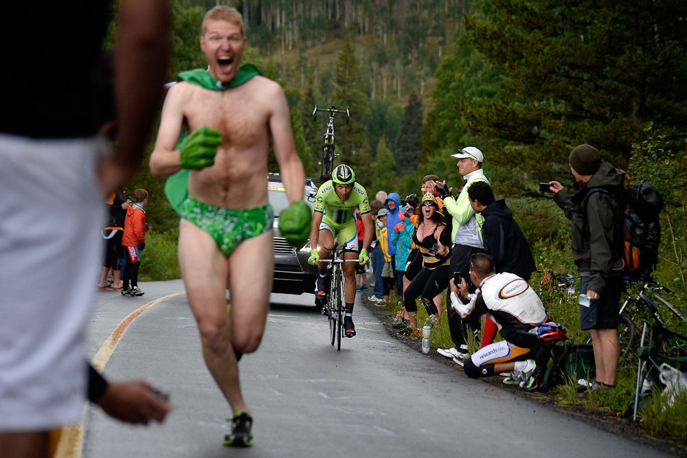 An enthusiastic fan runs ahead of Ivan Basso during the Vail time trial at the USA Pro Challenge