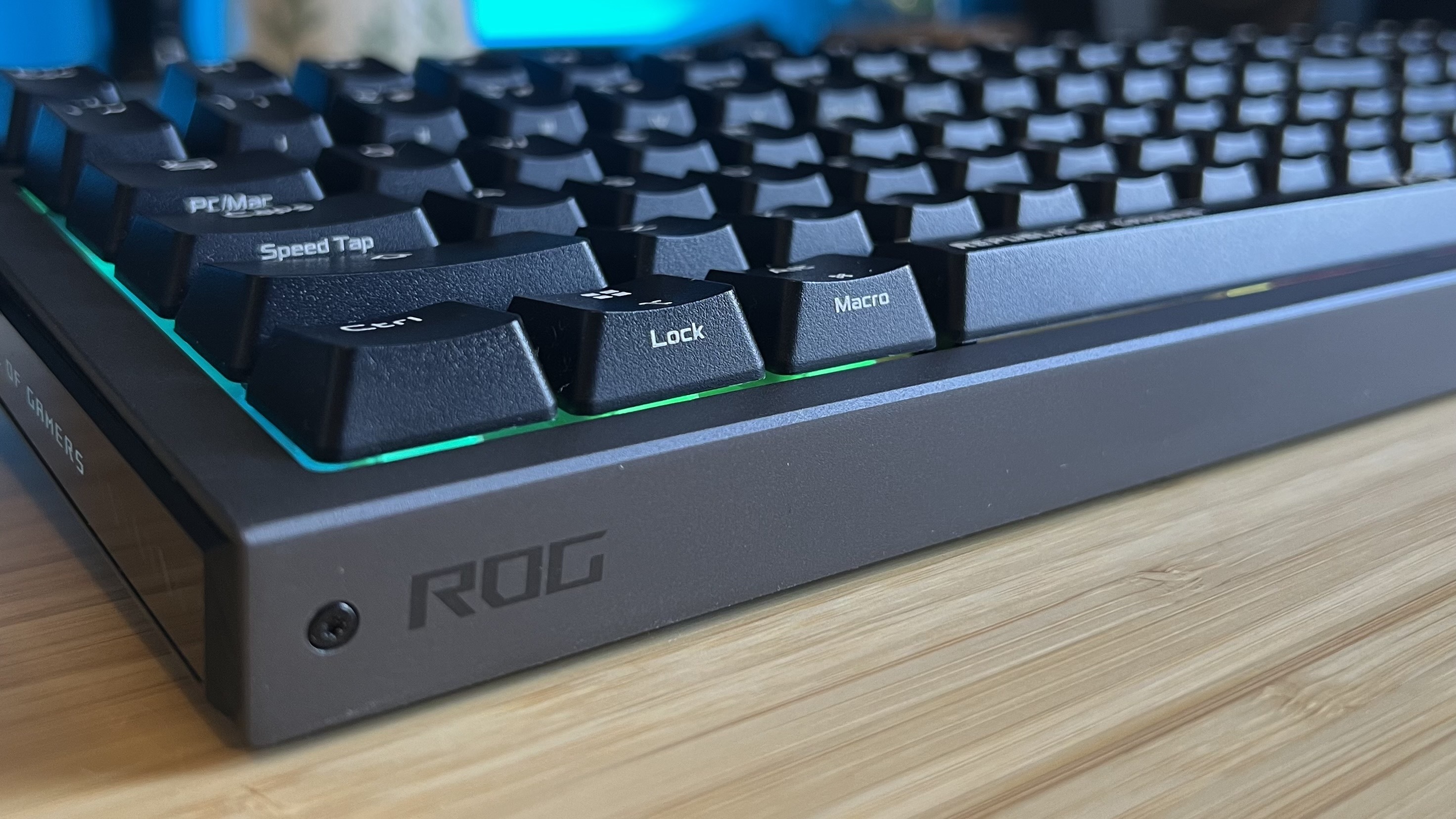 Close up on screw and ROG logo on bottom left corner of Asus ROG Strix Morph 96 Wireless gaming keyboard