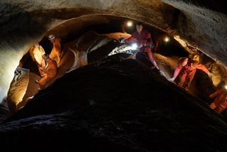 The 2013 European Space Agency CAVES team works its way through the subsurface in a Sardinian cave.