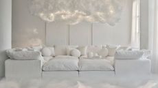 'Cloud Dancer' upholstered modular sofa from Joybird's Pantone collaboration, pictured in a similarly shaded, brightly lit living room