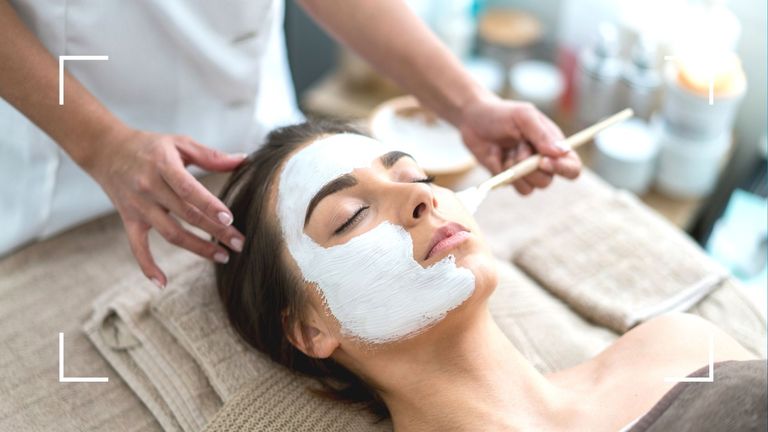 woman enjoying beauty treatment with a face mask