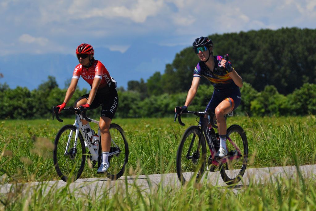 MORTEGLIANO ITALY JULY 09 Pauline Allin of France and Arkea Pro Cycling Team Hannah Barnes of United Kingdom and Canyon SRAM Racing Team during the 32nd Giro dItalia Internazionale Femminile 2021 Stage 8 a 1294km stage from San Vendemiano to Mortegliano Refreshment Bottle GiroDonne UCIWWT on July 09 2021 in Mortegliano Italy Photo by Luc ClaessenGetty Images