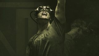Olive drab filter person wearing goggles reaching upwards and screaming