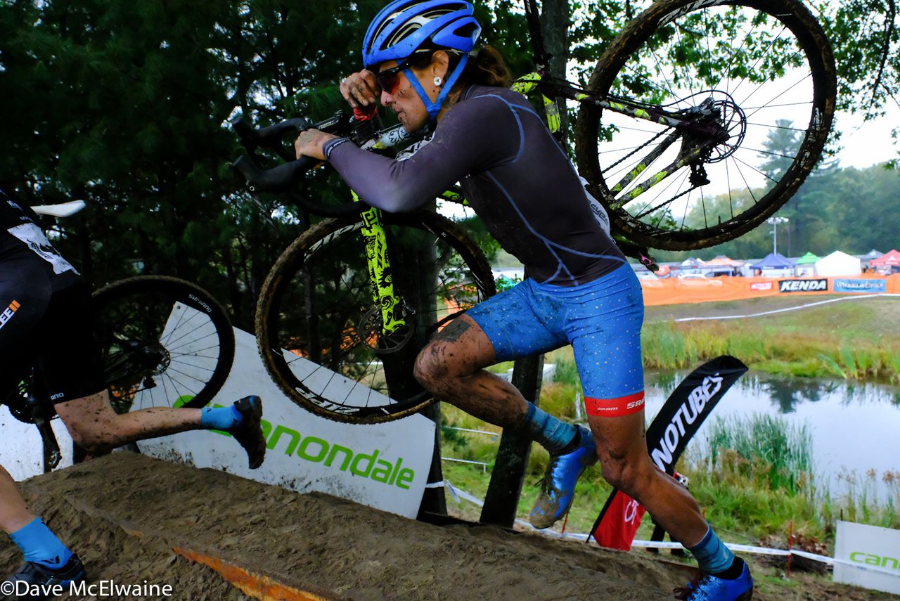 Anthony Clark (Squid Bikes) climbing a steep set of stairs on his way to a top ten finish