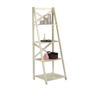A white wooden ladder shelf with decor on it
