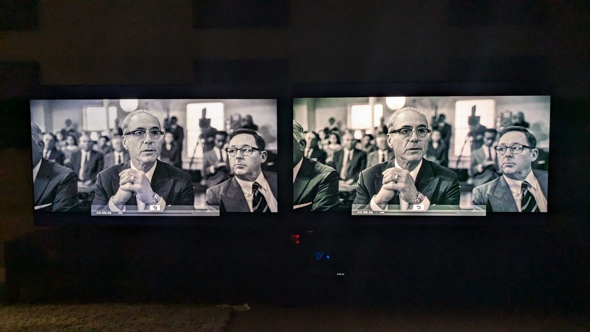Samsung QN85D and Hisense U7N with Oppenheimer black and white scene on screen in dark room