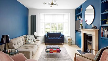 living room with fireplace and teal blue walls