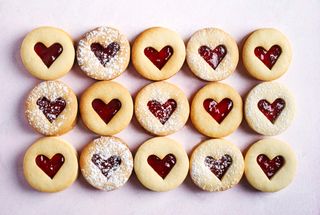 An abundance of heart shaped strawberry jaw shortbread biscuits.