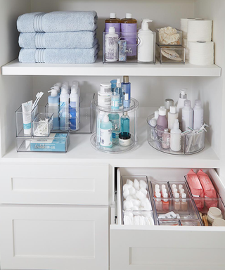 Categorized toiletries and cosmetics neatly arranged in acrylic containers