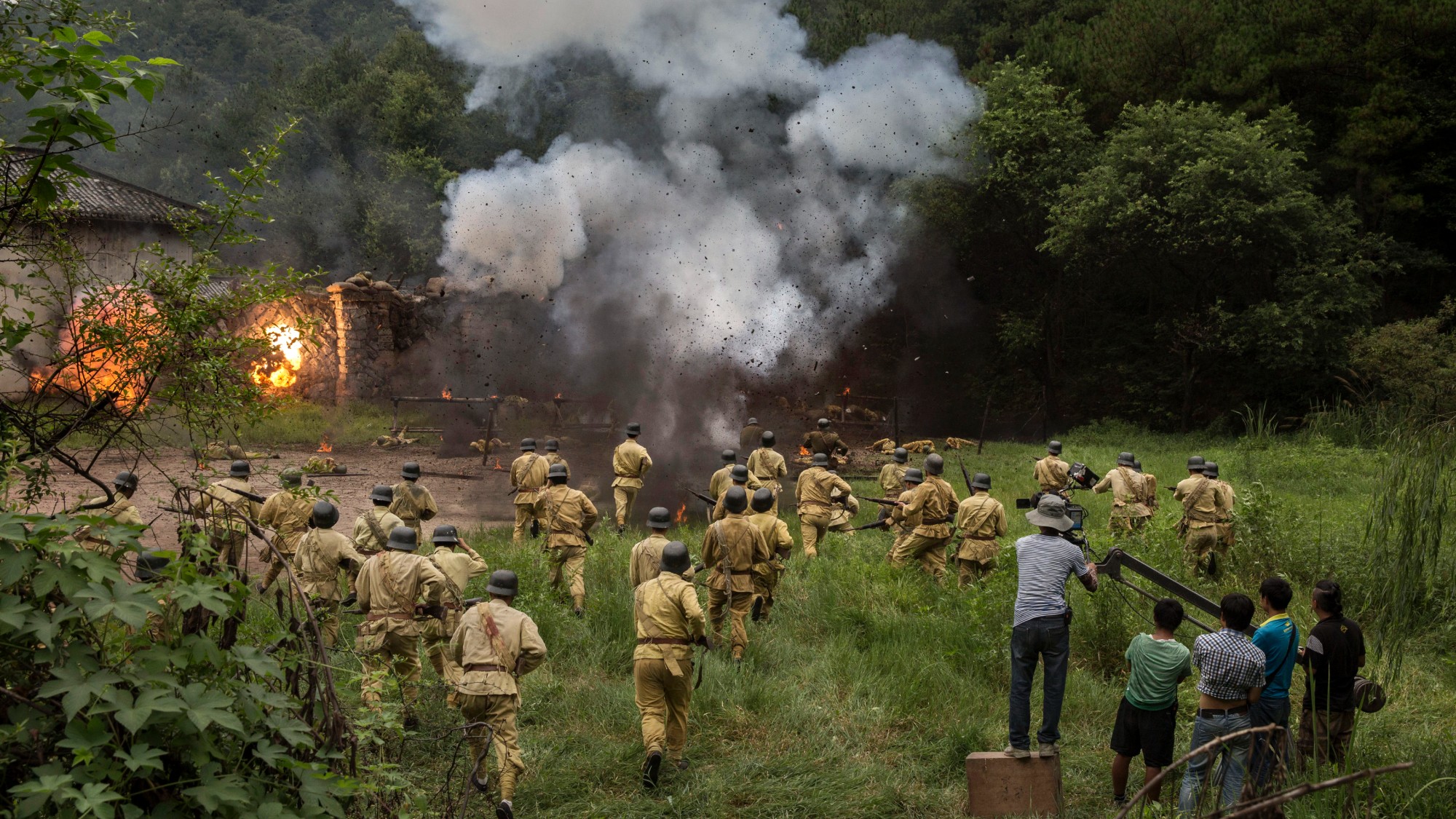 Chinese war film being filmed with actors dressed as soldiers