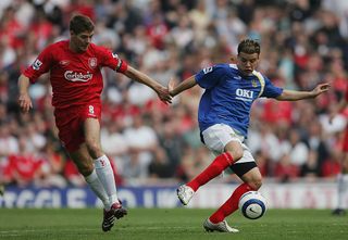Andres D'Alessandro of Portsmouth is challenged by Steven Gerrard of Liverpool during the Barclays Premiership match between Portsmouth and Liverpool at Fratton Park on May 7, 2006 in Portsmouth, England.