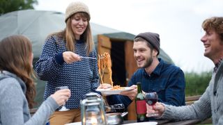 What is glamping: glampers enjoying a meal