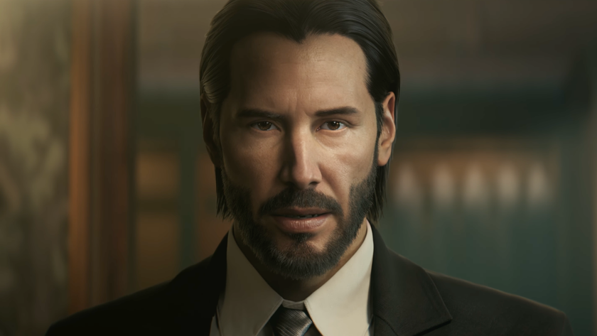 John Wick stares into the camera while wearing a suit