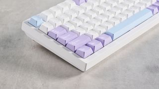 A white and purple Epomaker Ajazz AK820 Pro mechanical keyboard