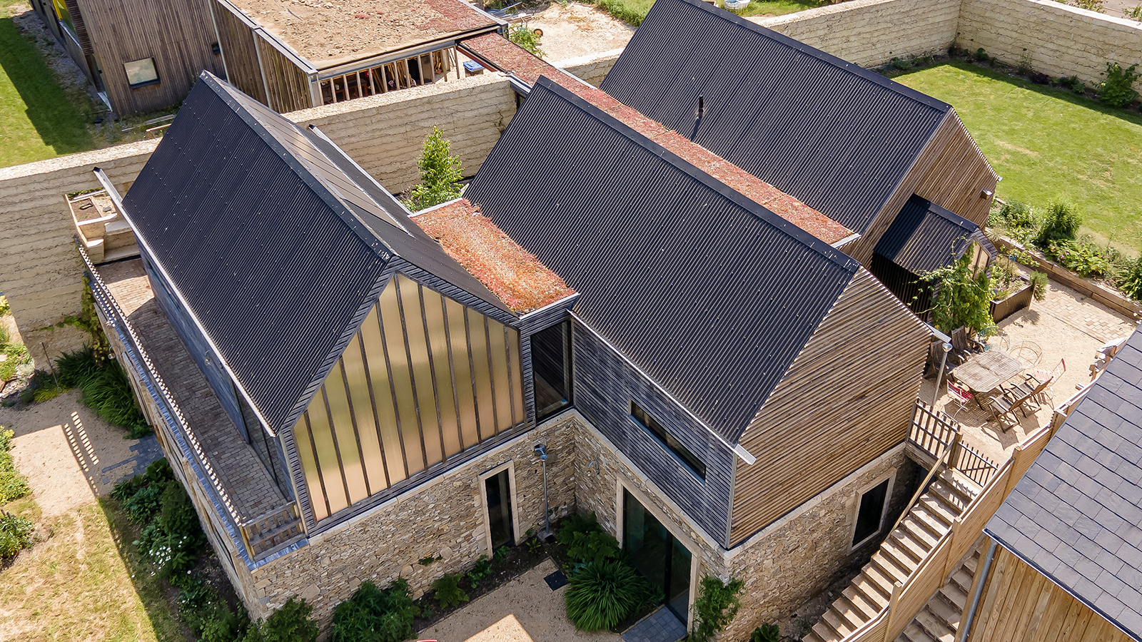 Drone shot overhead of three self-build projects alongside each other