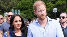 Prince Harry and Meghan, Duchess of Sussex walk and talk with Michael Hartung, CEO of Invictus Australia (not pictured) on day four of the royal trip on April 17, 2026